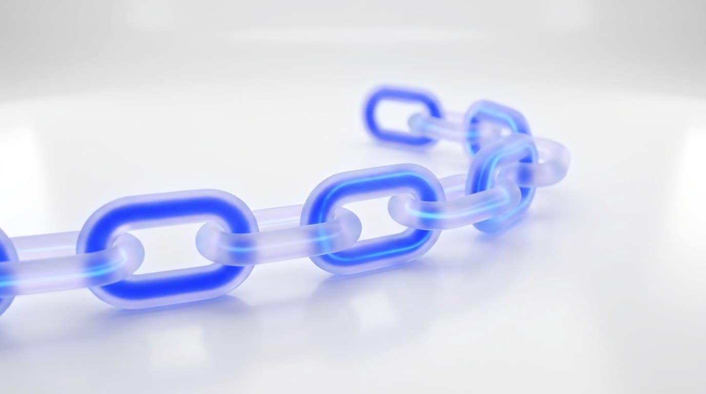 A cobalt blue chain of connected glass links curving across a bright white studio surface