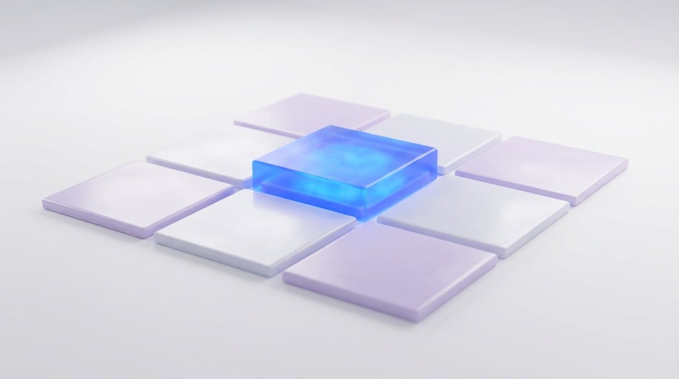 Nine matte ceramic tiles in cobalt and sky blue arranged in a grid on a white studio surface